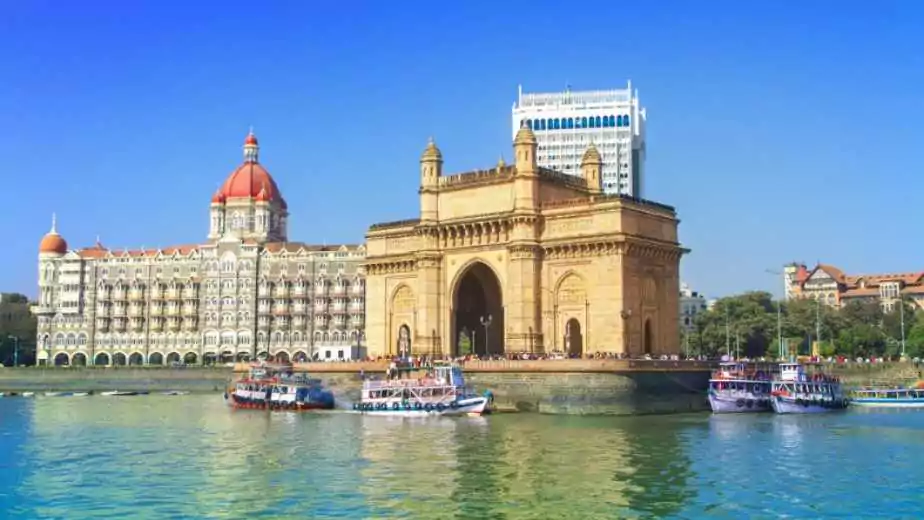 the gateway of india and boats as seen from the mumbai harbour in mumbai